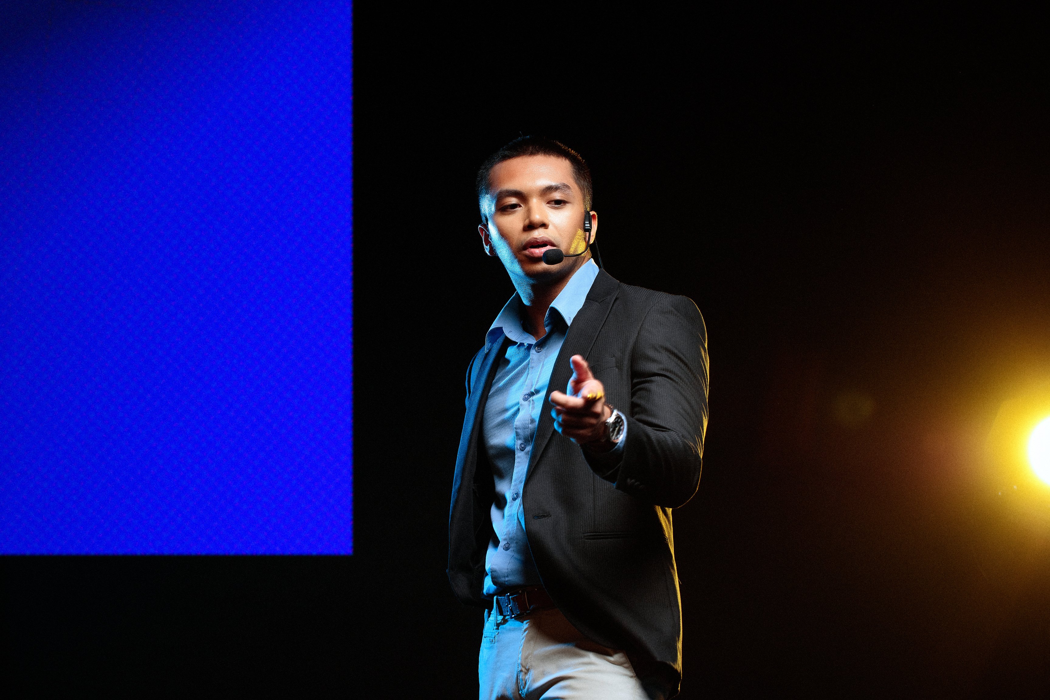 Man Giving a Talk in Public on Stage